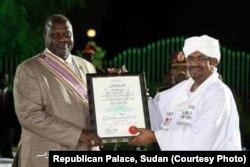 Sudanese President Omar al-Bashir, right, organized a peace award ceremony in Khartoum over the weekend of Sept. 21, 2018 to reward South Sudan Rebel leader Riek Machar, left, for signing the revitalized peace deal.