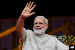 Indian Prime Minister Narendra Modi attends an event a day ahead of the implementation of the nationwide Goods and Services Tax (GST) in Ahmadabad, India, June 30, 2017.