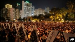 Hong Kong Tiananmen Anniversary: Tens of thousands of people attend a candlelight vigil at Victoria Park in Hong Kong, Saturday, June 4, 2016, to commemorate victims of the 1989 military crackdown in Beijing.