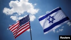 FILE - American and Israeli flags are seen at Ben Gurion International Airport in Lod, Israel, May 21, 2017.