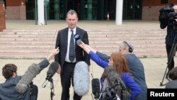 FILE - Former deputy speaker of the House of Commons Nigel Evans speaks to the media, after the end of his trial, outside Preston Crown Court, northern England, Apr. 10, 2014. Evans was cleared of sex abuse charges.