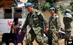 The last of Japan's troops prepare to board a plane as they leave Juba, South Sudan, May 25, 2017. The departure marks the end of Japan's five-year participation in the ongoing UN peacekeeping mission in South Sudan.