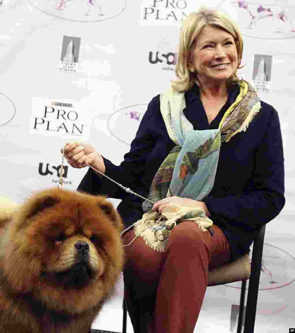 Martha Stewart sits her with her dog Genghis Khan , a Chow Chow breed, before competing in the Best of Group category at the 136th Westminster Kennel Club Dog Show in New York, February 13, 2012. (REUTERS)