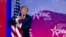 President Donald Trump hugs the American flag as he arrives to speak at Conservative Political Action Conference, CPAC 2019, in Oxon Hill, Md., Saturday, March 2, 2019.