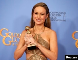 Brie Larson poses with the award for Best Performance by an Actress in a Motion Picture - Drama for her role in "Room" during the 73rd Golden Globe Awards in Beverly Hills, Calif., Jan. 10, 2016.
