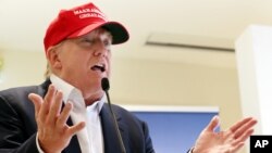 Donald Trump speaks to the media during a press conference on the 1st first day of the Women's British Open golf championship on the Turnberry golf course in Turnberry, Scotland, July 30, 2015.