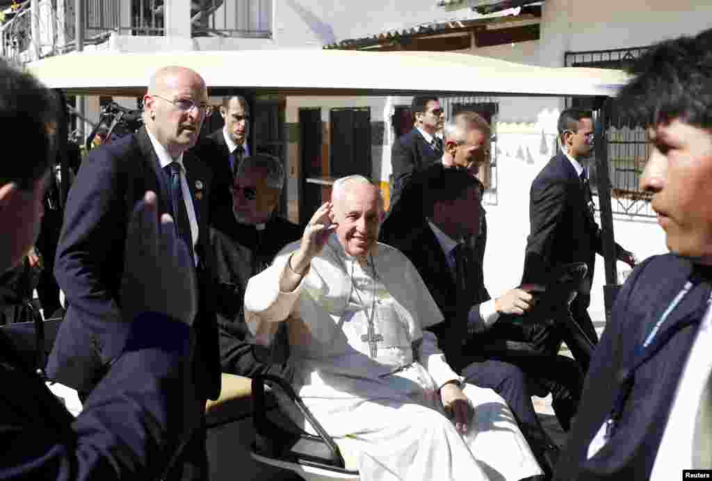 Pope Francis waves as he leaves the prison of Palmasola in Santa Cruz, Bolivia July 10, 2015.