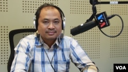 FILE - Kim Sok participates in a Voice of America call-in radio show, February 13, 2017. (Lim Sothy/VOA Khmer)
