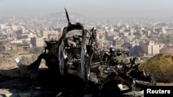 The wreckage of a vehicle at the site of air strikes in Sanaa, Yemen, Dec. 26, 2017.