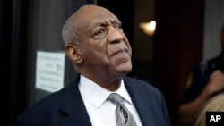 FILE - Bill Cosby exits the Montgomery County Courthouse after a mistrial was declared in Norristown, Pennsylvania, June 17, 2017.