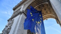 A picture taken on Ja. 1, 2022 shows the European Union flag under the Arc de Triomphe, on the Place de l'Etoile in Paris.