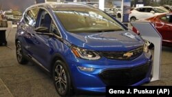 In this Feb. 13, 2020 file photo a 2020 Chevrolet Bolt EV is displayed at the 2020 Pittsburgh International Auto Show in Pittsburgh.(AP Photo/Gene J. Puskar, File)