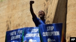 FILE - An opposition Democratic Alliance (DA) supporter voices his support after a protest march to the Constitutional Court in Johannesburg, April 15, 2016.