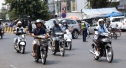 FILE: Motorists on a street in Phnom Penh, Cambodia, February 11th, 2020. (Malis Tum/VOA Khmer)