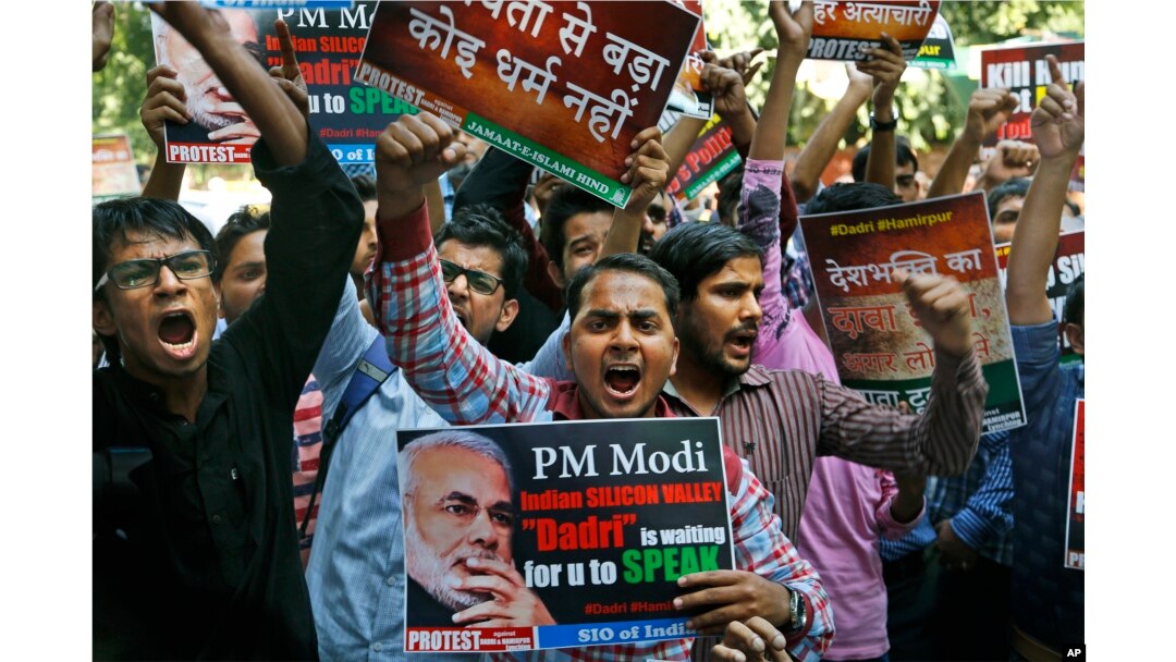 Activists of various Indian Muslim groups shout slogans against Indian prime minister Narendra Modi during a protest against the killing of a Muslim farmer, in New Delhi, India, Oct. 6, 2015.