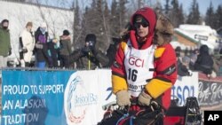 Mitch Seavey takes off two positions ahead of his son, reigning champion Dallas Seavey, at the start of the 45th Iditarod Trail Sled Dog Race in Fairbanks, Alaska, Monday, March 6, 2017.