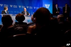FILE - Wilson Center Vice President for New Initiatives and Distinguished Fellow Aaron David Miller, left, speaks with Israeli Defense Minister Moshe Ya'alon at the Wilson Center, in Washington, March 14, 2016.