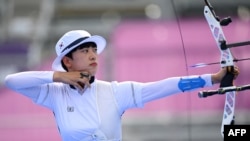 South Korea's An San competes in the women's individual during the Tokyo 2020 Olympic Games at Yumenoshima Park Archery Field in Tokyo on July 30, 2021. (Photo by ADEK BERRY / AFP)