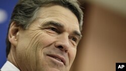 Republican presidential candidate, Texas Gov. Rick Perry announces he is suspending his campaign and endorsing Newt Gingrich during a news conference in North Charleston, S.C., January 19, 2012.