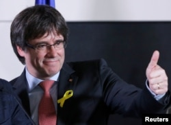 Carles Puigdemont, the dismissed president of Catalonia, arrives to speak after watching the results of Catalonia's regional election in Brussels, Belgium, Dec. 21, 2017.