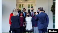 ayapal leads a group of Democratic members of Congress after meeting with Biden