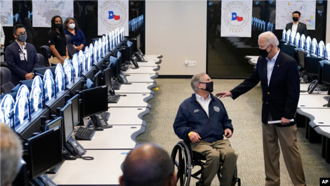 President Biden talks with Texas Governor Greg Abbott as they inspect the Harris County Operations Center (February 26, 2021)