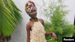 A model poses in a dress made of condoms by Felicite Luwungu in Kinshasa, Democratic Republic of Congo, Dec. 5, 2017.