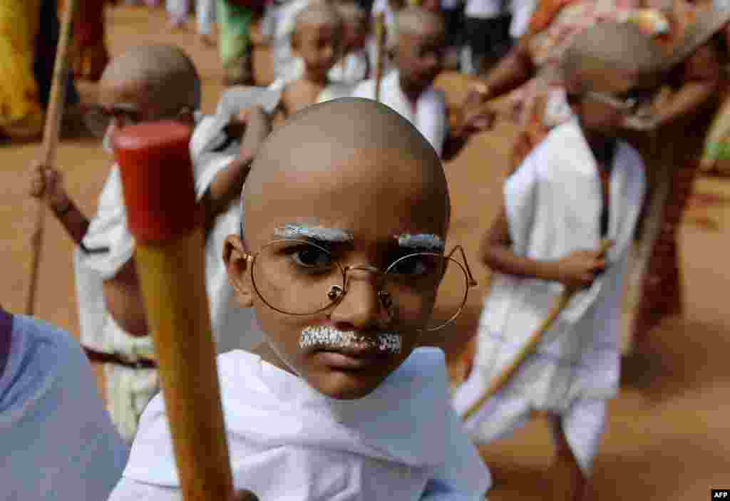 Indian school children dressed like Mahatma Gandhi assemble during an event at a school in Chennai, ahead of Gandhi&#39;s birth anniversary.