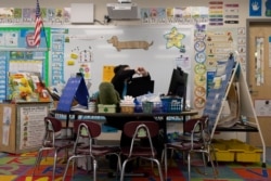 Kindergarten teacher Nicole Jones gives an online lesson to her virtual students while teaching at Kratzer Elementary School in Allentown, Pennsylvania, U.S. April 13, 2021.