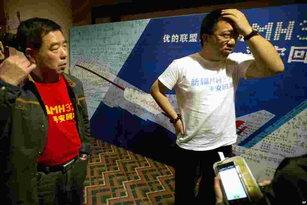 Steve Wang a representative from the committee for relatives of Chinese passengers onboard Flight MH370 talks to journalists after a closed door meeting with Malaysian officials via teleconference in Beijing, April 2, 2014.