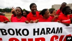Women sing slogans during a demonstration calling on the government to rescue the kidnapped girls of the government secondary school in Chibok. Abuja, Nigeria, May 28, 2014.