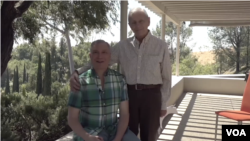 Alexei Romanoff with his spouse, David Farah, at their Los Angeles home.