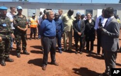 FILE - U.N. Secretary-General Antonio Guterres listens to U.N. staff in Bangui, Central African Republic, Oct. 25, 2017. Guterres, visiting one of the most volatile towns in CAR, thanked peacekeepers for their "extraordinary courage."