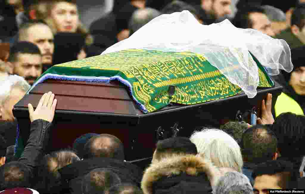 Mourners carry the coffin of Tugce Albayrak outside a mosque during a memorial service for late student in Waechtersbach, Dec. 3, 2014..