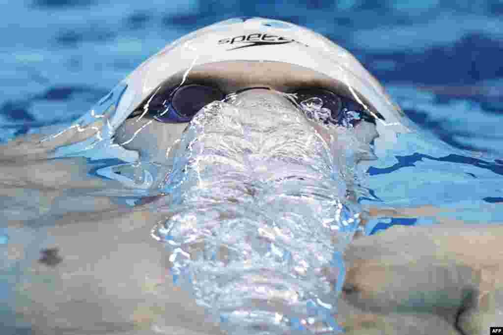 Russia&#39;s Evgeny Rylov competes in a heat for the men&#39;s 200m backstroke swimming event during the Tokyo 2020 Olympic Games at the Tokyo Aquatics Center in Tokyo, Japan.