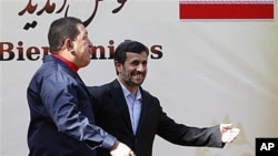 Iranian President Mahmoud Ahmadinejad, center, welcomes his Venezuelan counterpart Hugo Chavez, during an official welcoming ceremony, in Tehran, Iran, 19 Oct 2010