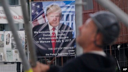 President Donald Trump visits and speaks with workers as he is