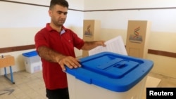 A Kurdish election officer prepares ballot boxes fora Sept. 25 independence referendum in Irbil, Iraq, Sept. 24, 2017. 