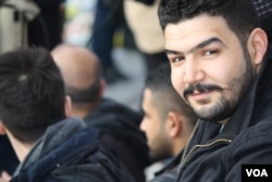 Mustafa Mohammed, an Iraqi refugee, attends a vigil for the victims of the Brussels bombing on 26 March 2016 in Brussels, Belgium. (VOA/H. Murdock)