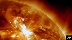 This NASA image shows a solar flare erupting on the Sun's northeastern hemisphere, January 22, 2012.