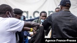 FILE - A man is arrested during a protest against police brutality and harassment, especially against the poor, in Nairobi on July 7, 2021.