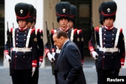 FILE - Then-Italian Prime Minister Silvio Berlusconi walks before a meeting at Palazzo Chigi in Rome, Nov. 13, 2009.