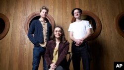 Members of the American folk rock band The Lumineers, from left, Wesley Schultz, Neyla Pekarek and Jeremiah Fraites at the Dream Downtown Hotel in New York, Jan 18, 2013.
