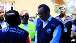 Dr. Tedros Adhanom Ghebreyesus, WHO Director General, centre, speaks to a health official at a newly established Ebola response center in Beni, Democratic Republic of Congo, Friday, Aug. 10, 2018. 