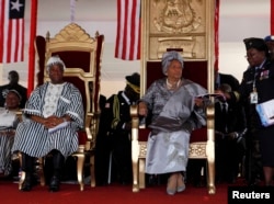 FILE - Liberian President Ellen Johnson-Sirleaf (seated R) and Liberian Vice President Joseph N. Boakai (L) attend Sirleaf's second presidential inauguration at the Capitol in Monrovia, Jan. 16, 2012.