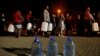 FILE - People queue to collect water from a spring in the Newlands suburb as fears over the city's water crisis grow in Cape Town, South Africa, Jan. 25, 2018.