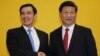 FILE - Chinese President Xi Jinping shakes hands with Taiwan's President Ma Ying-jeou during a Nov. 7, 2015, summit in Singapore. Leaders of political rivals China and Taiwan met Saturday for the first time in more than 60 years.