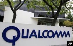 FILE - The corporate sign of Qualcomm Inc. is seen in front of its office in Santa Clara, California, April 18, 2011.