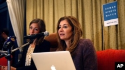 FILE - Sarah Leah Whitson (r), then the Human Rights Watch MENA director, speaks during a press conference in Sanaa, Yemen, Jan. 27, 2014.