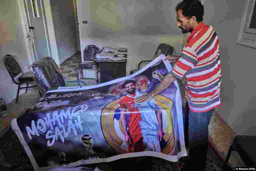 Hassan Bakr lays out a poster featuring Nagrig&#39;s most famous son.